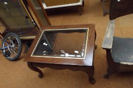 Glass topped coffee table