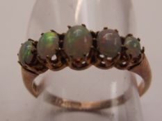 9ct yellow gold ring with 5 opals. Size N