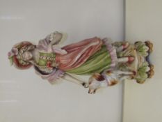 A german edwardian bisque figure of a lady and a d