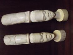 Pair of early 20th century African carved ivory tu