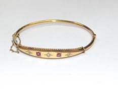 9ct yellow gold bangle set with 3 diamonds and 2 r