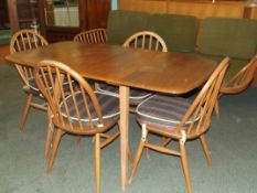 Ercol drop leaf dining table in light elm, carried