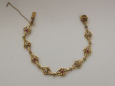 An unusual Victorian 18ct gold ruby and diamond bracelet that is comprised with four (4) old cut