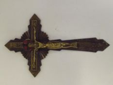 A brass crucifix with the letter NR 40cm X 24cm