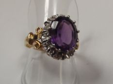 18ct yellow gold ring with a large central amethys