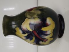 Moorcroft pottery footed vase, baluster form in th