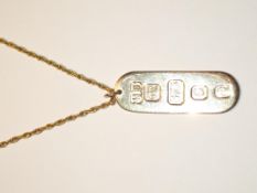 9ct gold ingot pendant on a 9ct gold chain. Approx