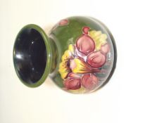 A small Moorcroft vase, Moorcroft trade label on t
