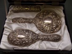 Cased silver four piece silver dressing table set,
