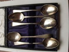 Part set of 5 cased silver hallmarked spoons, earl