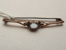 9 carat gold brooch with blue stone