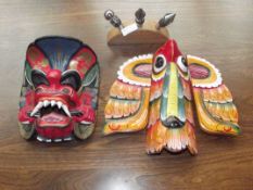 Two wall masks together with wine stopper set