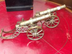 Pair of large brass desk cannons