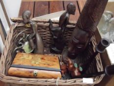 Basket to include treen candlesticks, ethnic carvi