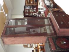 Victorian bookcase over four drawers in mahogany
