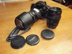 Canon E0S 750 camera with two lenses, EF75-300mm a