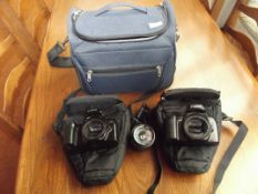 Two Canon E0S 100F cameras and lens