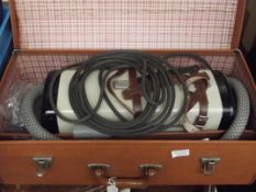 Cased vintage vacuum cleaner