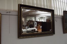 Framed bevelled mirror