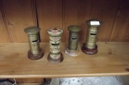 Four brass Post Office boxes