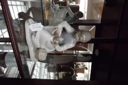 Nao figure of a seated girl