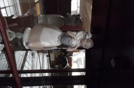 Nao figure of a lady and lamb