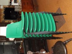 9 green stacking chairs