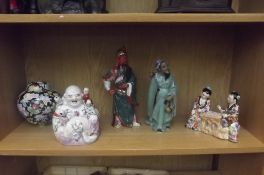 Shelf of oriental figures