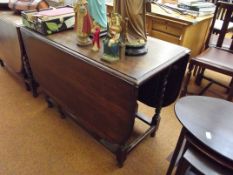 Oak drop leaf dining table on barley twist support