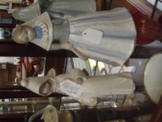 Lladro figure of a girl with one other figure