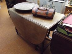 Oak drop leaf dining table on barley twist support