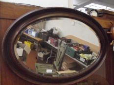Wood framed oval mirror