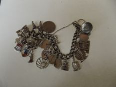 Solid silver Albert style bracelet with 25 charms