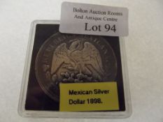 A Mexican silver dollar 1898