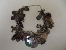 Solid silver Albert style bracelet with 37 charms