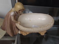 An early Royal Dux figure of a child, repair to ar