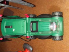 Holcast battery mower, working