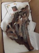 Resin wall plaque in the form of a leash of foxes