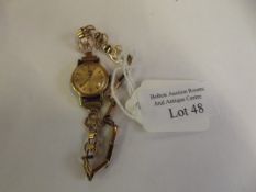 Tissot lady's wrist watch with 9ct gold bracelet.