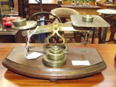 Brass and oak postal scales