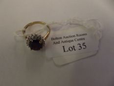 9ct gold ring with large red stone