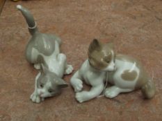 Two Lladro cats