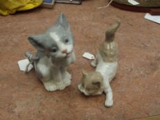 Two Lladro cats