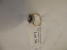 9ct gold cluster ring with blue and white stones