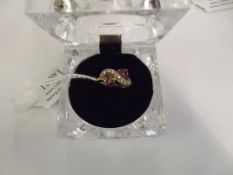 9ct gold ring with rubies and diamonds, stone miss