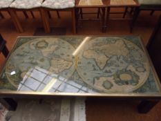 Very old coffee table with map of the world