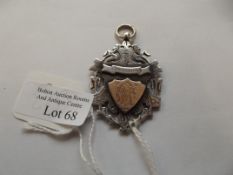 Silver swimming medal with 9ct gold inset