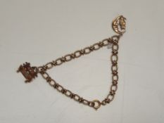 9ct gold charm bracelet with 3 charms. Approx 12 g