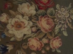 19th century Berlin woolwork, depicting flowers, tufted and worked in red, pink and blue, 64cm x