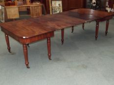 19th century extending table in mahogany on turned legs, 291cm x 129cm x 72cm fully extended with